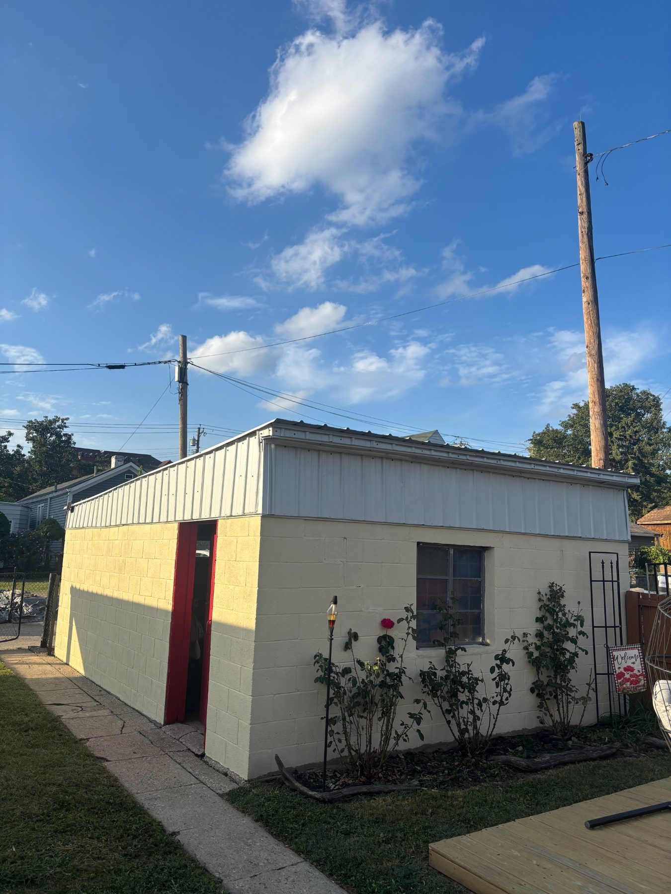 After: wider view of the same outbuilding exterior