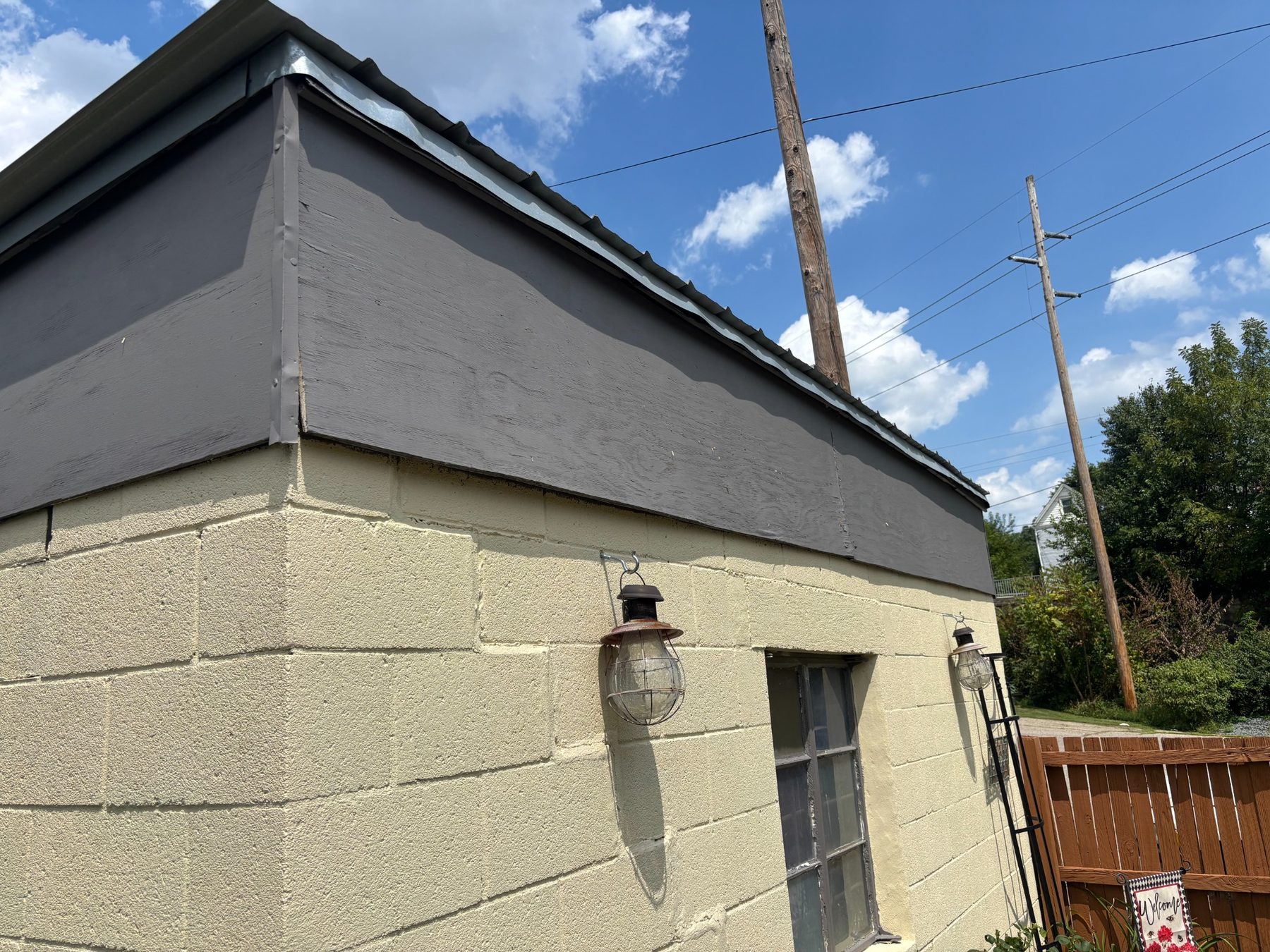 Before: close view of the outbuilding exterior