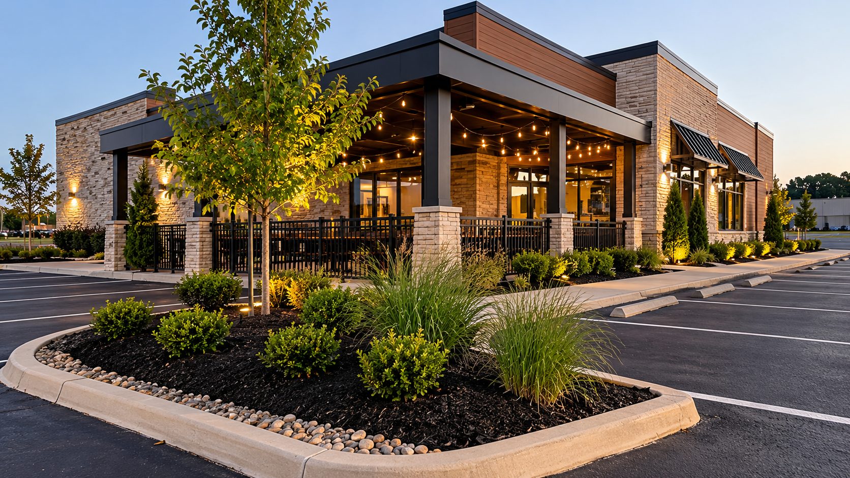 Illustrative modern restaurant property with landscaped beds and parking area
